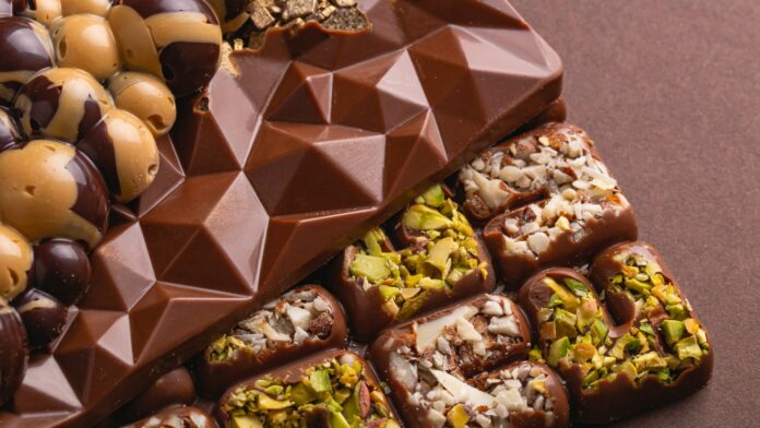 A variety of chocolates and nuts on a table