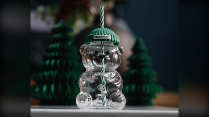 The original Starbucks Bearista glass cold cup with a green knit hat